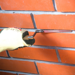 Bricklaying trowel, wooden handle 